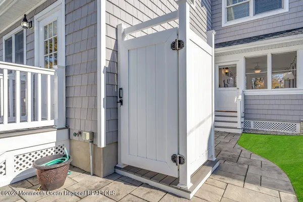 a front view of a house with a yard and porch