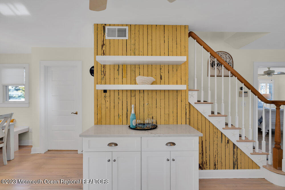 303 B Street Belmar, NJ 07719 - Photo 18 of 78 a view of staircase with wooden floor and a potted plant