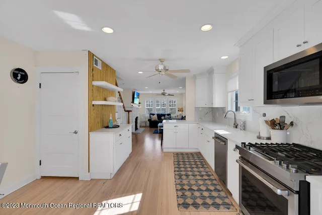 a white bath tub sitting next to a window
