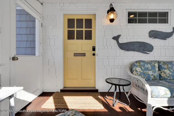 a kitchen with stainless steel appliances kitchen island granite countertop a refrigerator a stove a microwave oven a sink with island and chairs