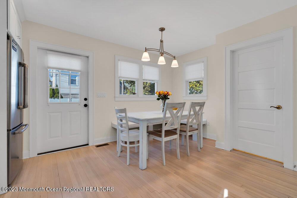 303 B Street Belmar, NJ 07719 - Photo 24 of 78 a view of a dining room with furniture and wooden floor