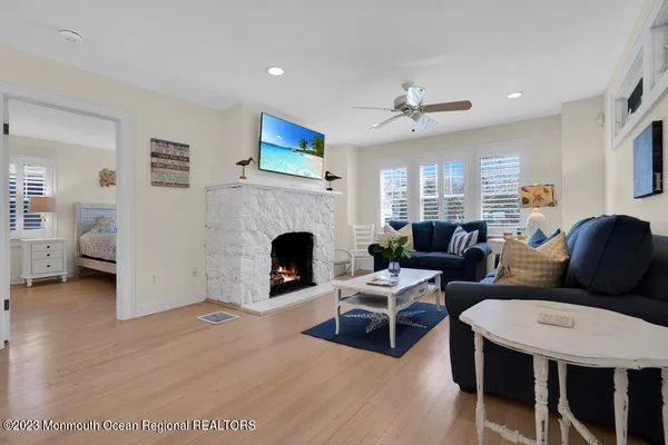a view of a dining room with furniture and wooden floor