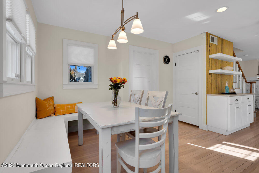 303 B Street Belmar, NJ 07719 - Photo 25 of 78 a view of a dining room with furniture and wooden floor