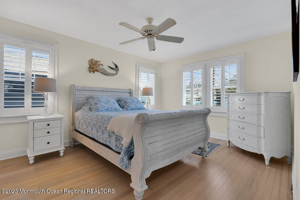 303 B Street Belmar, NJ 07719 - Photo 26 of 78 a bedroom with a bed and a dresser