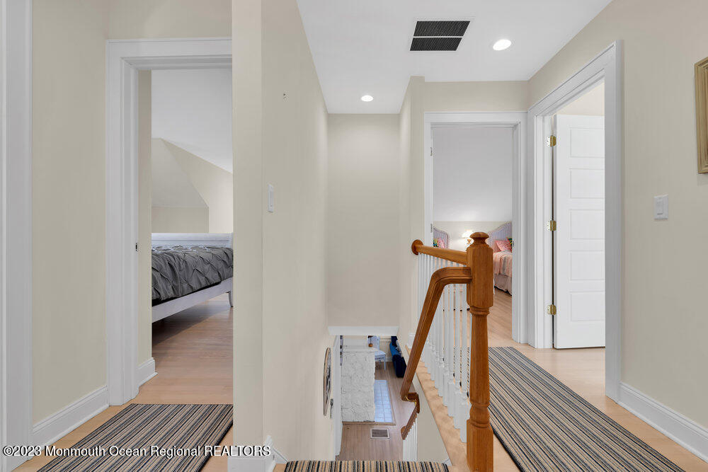 303 B Street Belmar, NJ 07719 - Photo 36 of 78 a view of a hallway with furniture and stairs