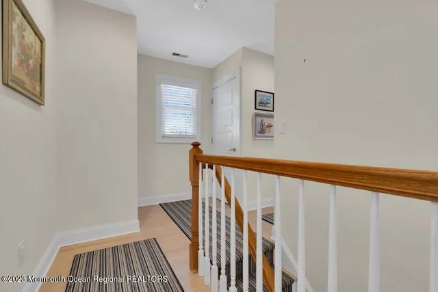 a front view of a house with a garden and plants