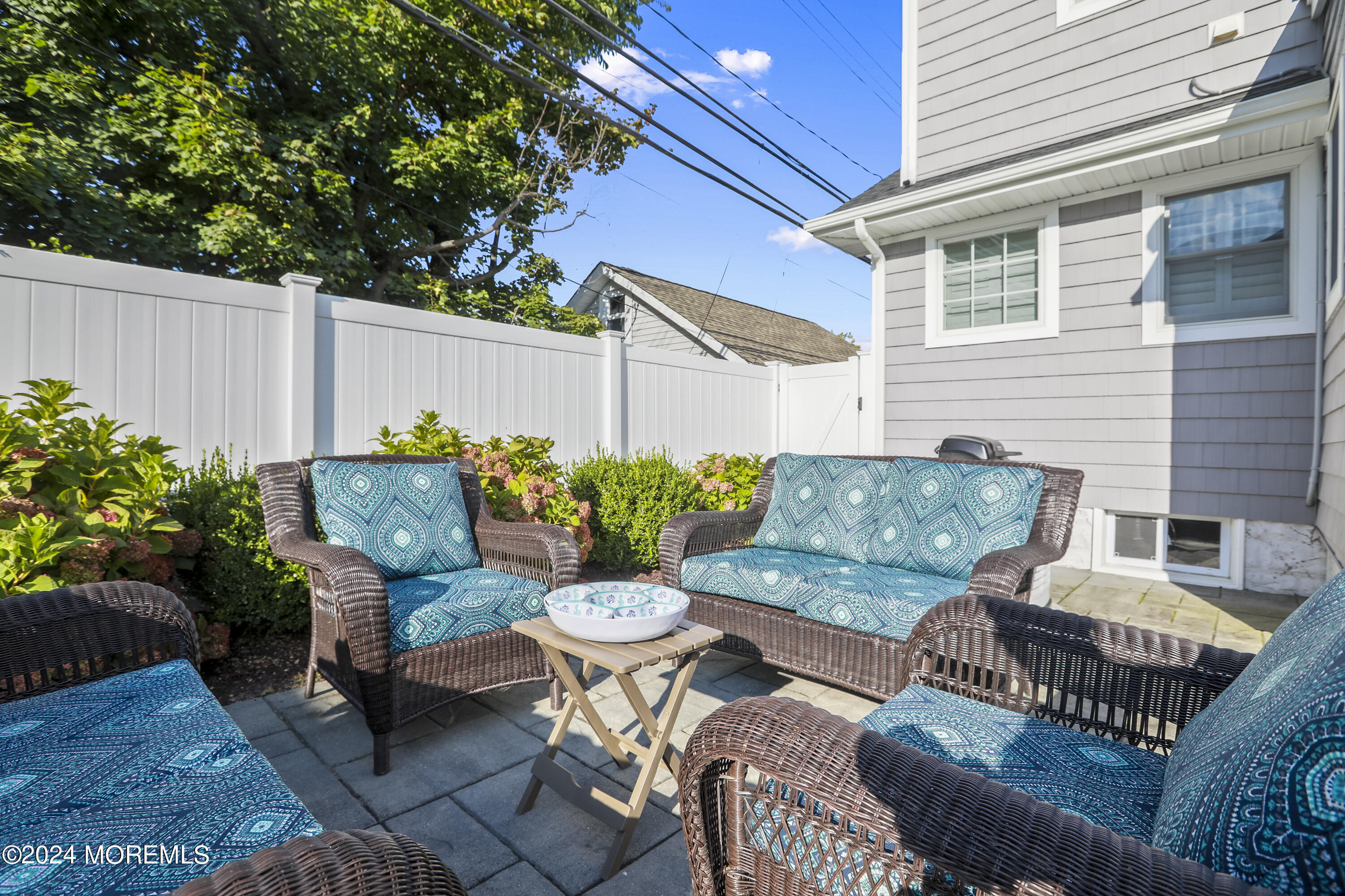 303 B Street Belmar, NJ 07719 - Photo 4 of 78 a view of a patio with couches table and chairs and potted plants