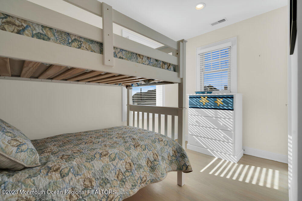 303 B Street Belmar, NJ 07719 - Photo 41 of 78 a bedroom with a bed and a window