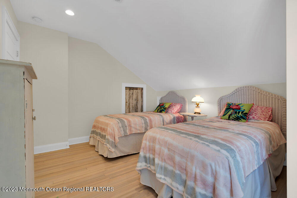 303 B Street Belmar, NJ 07719 - Photo 43 of 78 a bedroom with two beds and a lamp