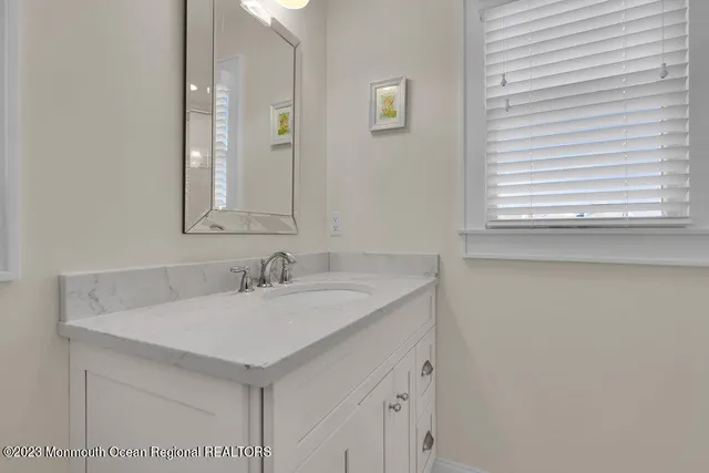 a view of a house with backyard sitting area and garden
