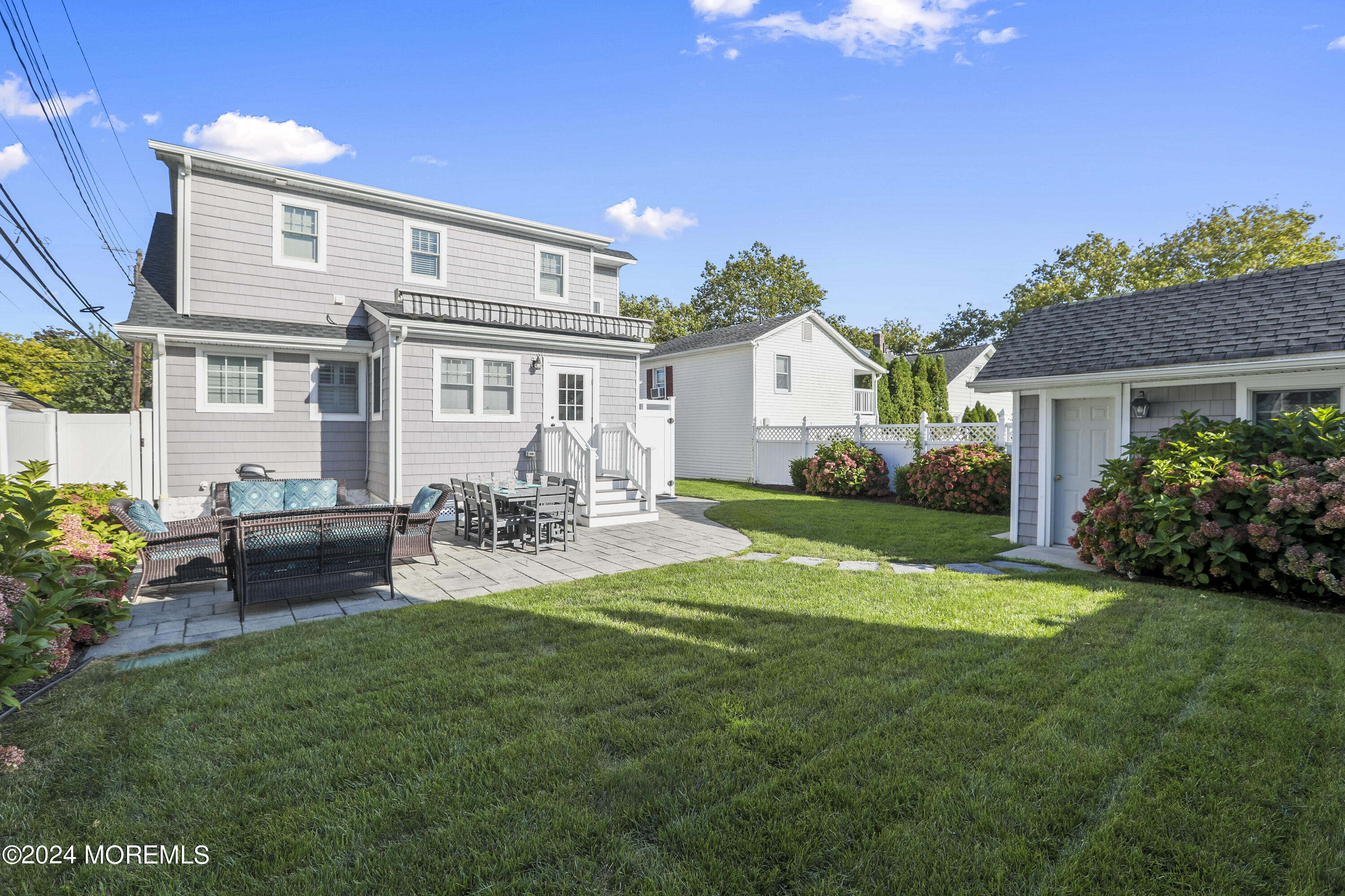 303 B Street Belmar, NJ 07719 - Photo 74 of 78 a view of a house with backyard sitting area and garden