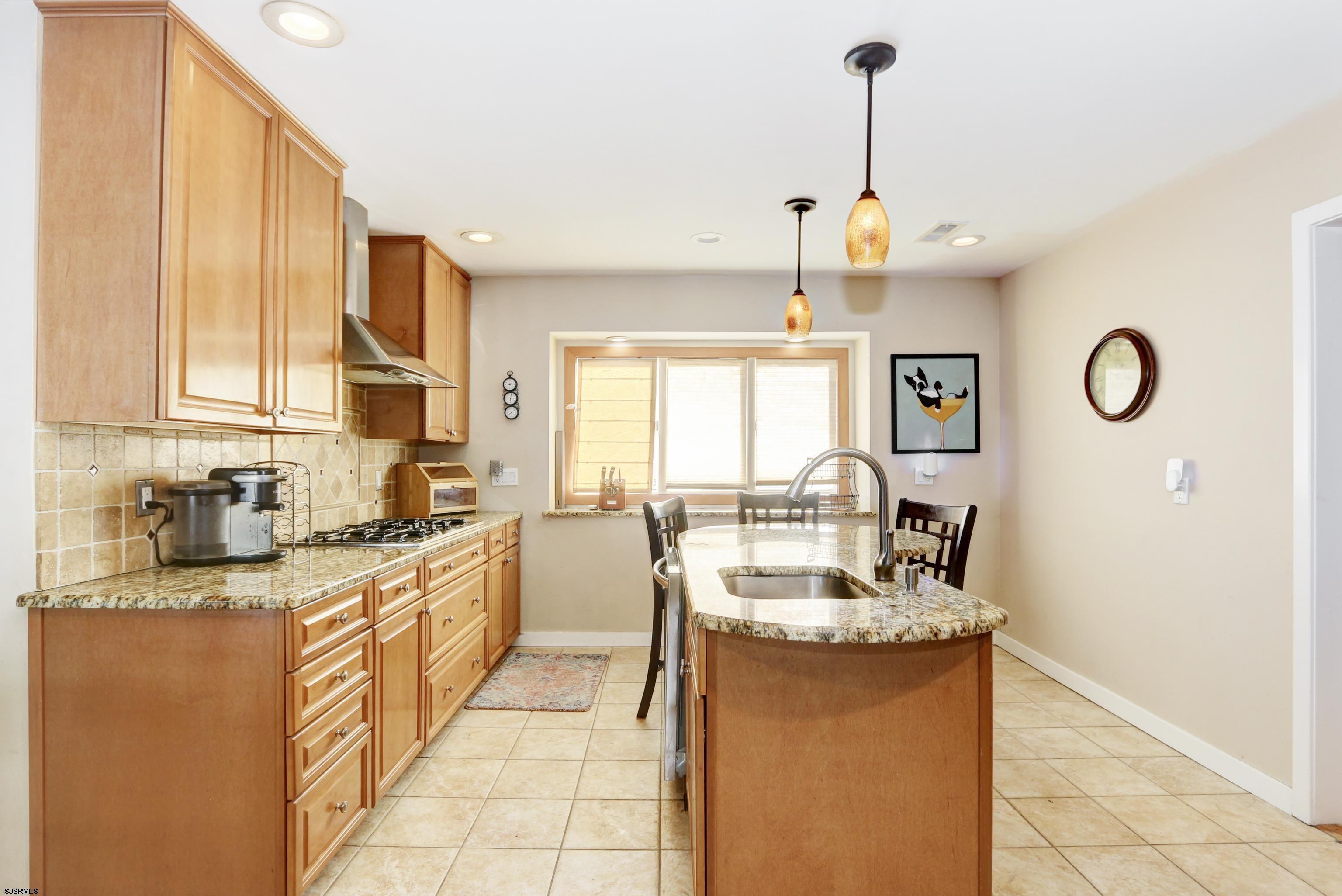 1860 Franklin Boulevard Linwood, NJ 08221 - Photo 11 of 39 a large kitchen with granite countertop a sink counter top space appliances and cabinets
