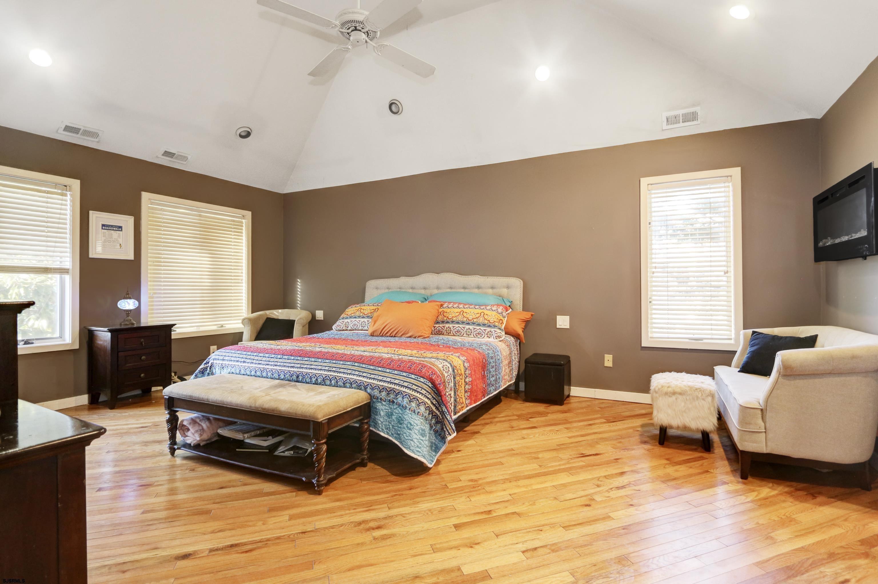 1860 Franklin Boulevard Linwood, NJ 08221 - Photo 15 of 39 a bedroom with a bed and wooden floor