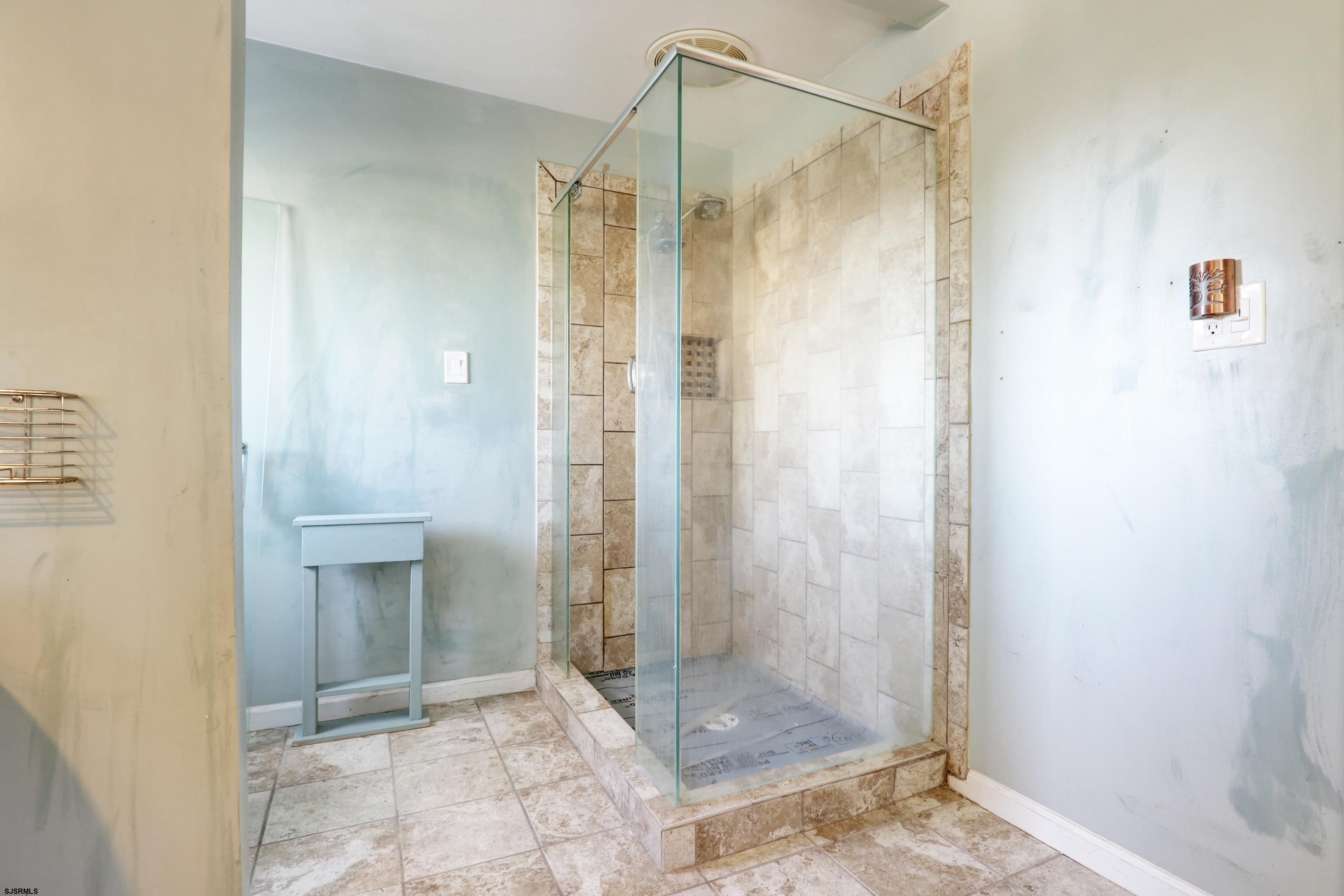 1860 Franklin Boulevard Linwood, NJ 08221 - Photo 16 of 39 a bathroom with a shower and a sink