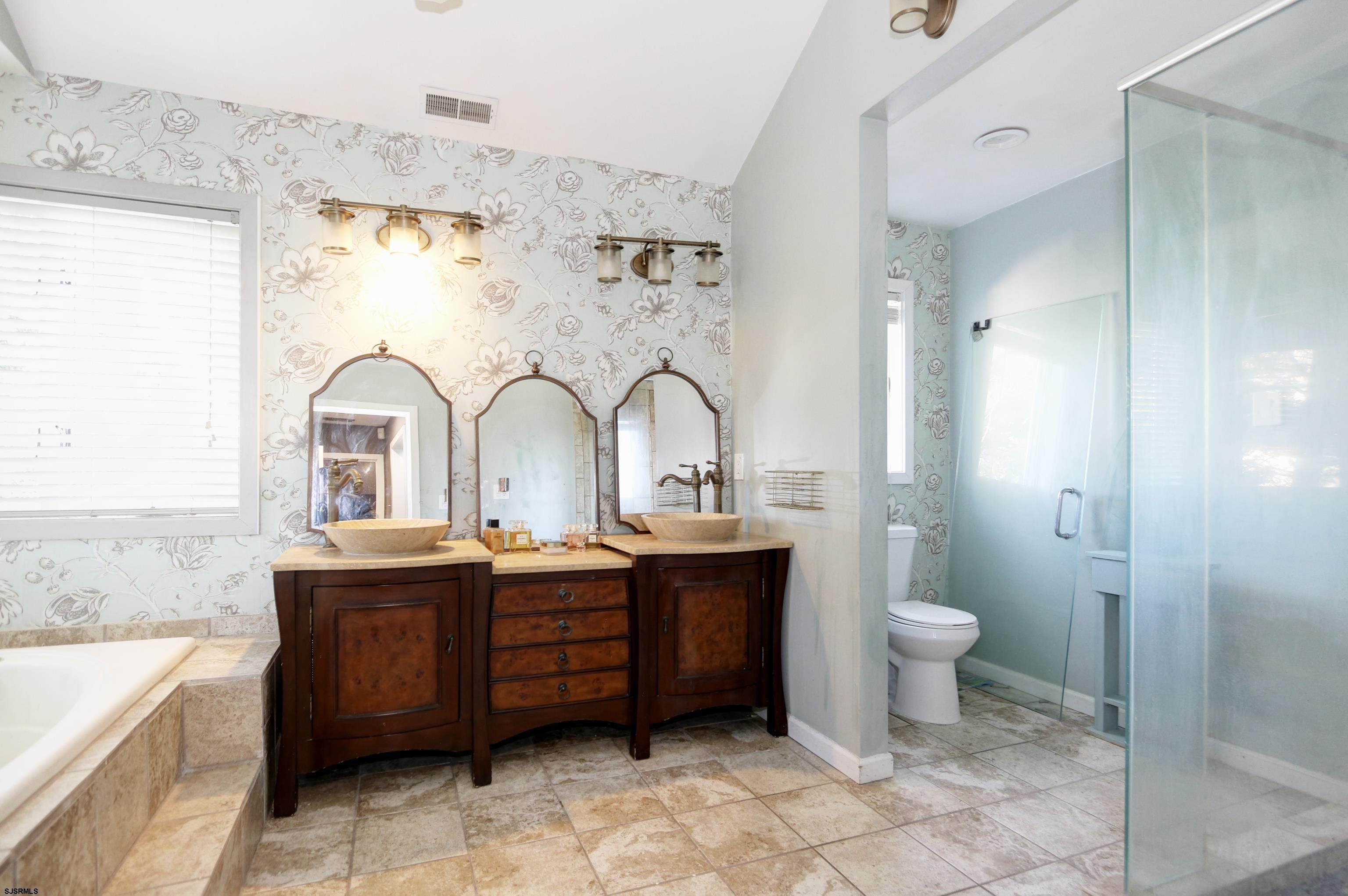 1860 Franklin Boulevard Linwood, NJ 08221 - Photo 17 of 39 a bathroom with a double vanity sink mirror and toilet