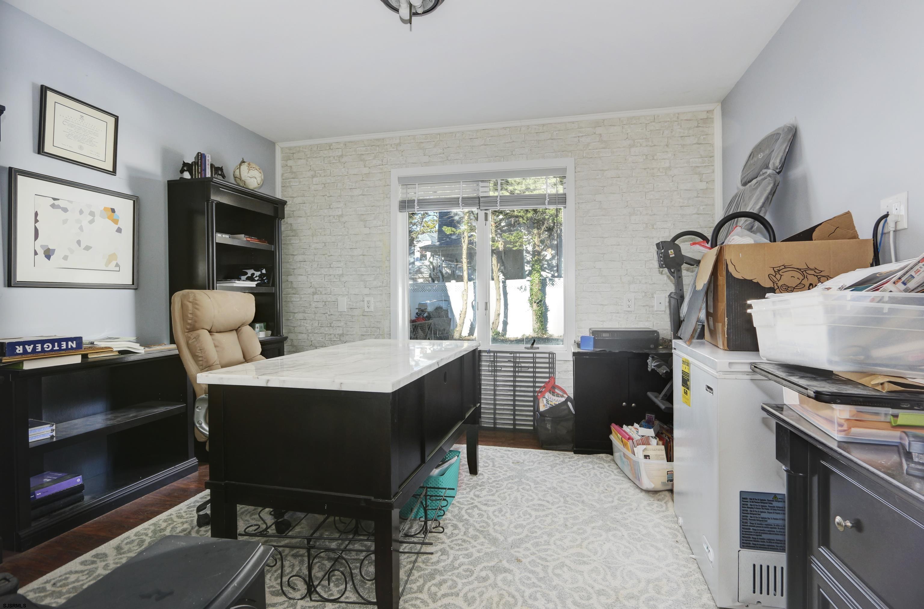 1860 Franklin Boulevard Linwood, NJ 08221 - Photo 23 of 39 a room with furniture a rug and a window