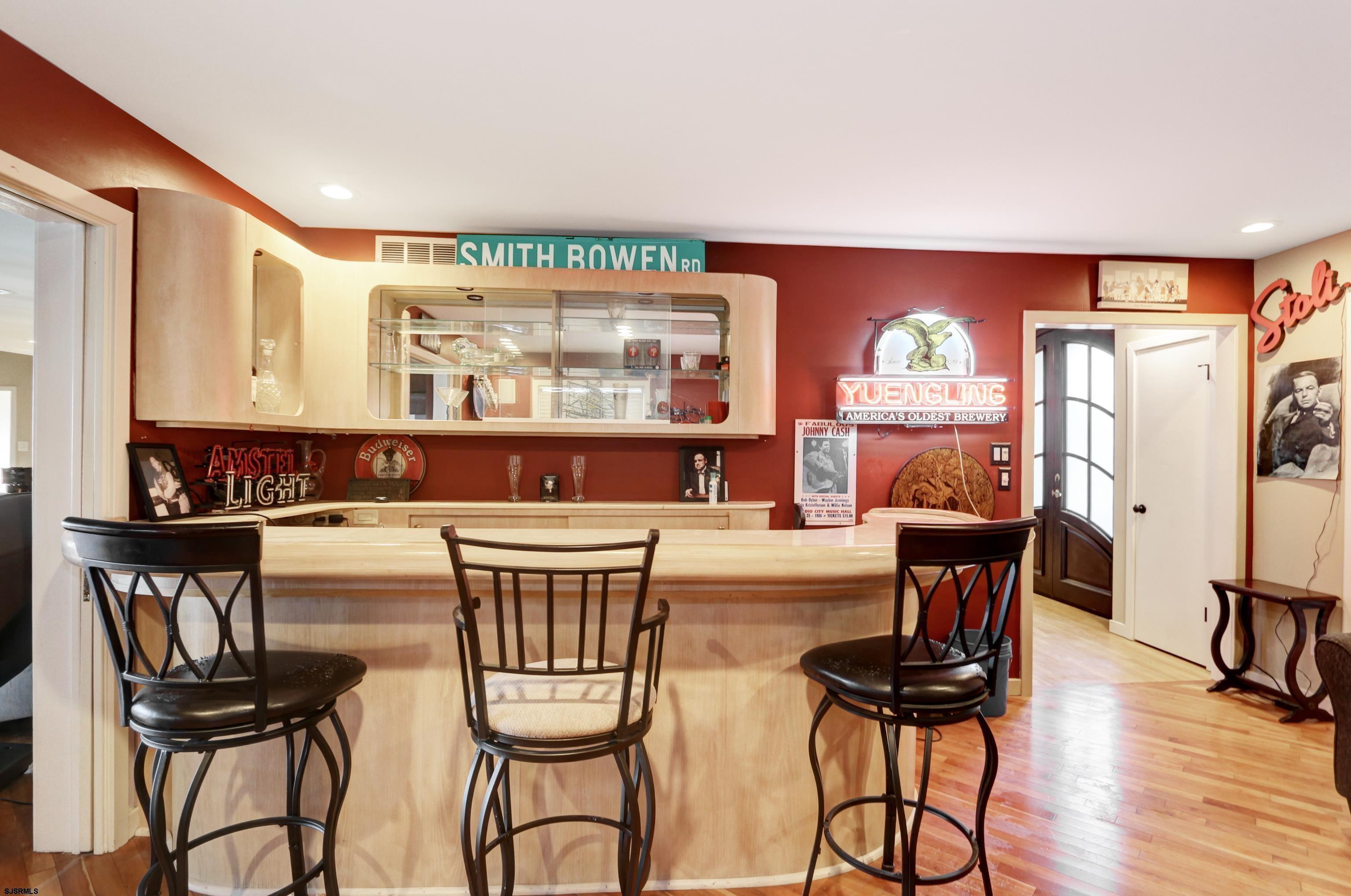 1860 Franklin Boulevard Linwood, NJ 08221 - Photo 25 of 39 a kitchen with stainless steel appliances kitchen island granite countertop a dining table chairs and a large window