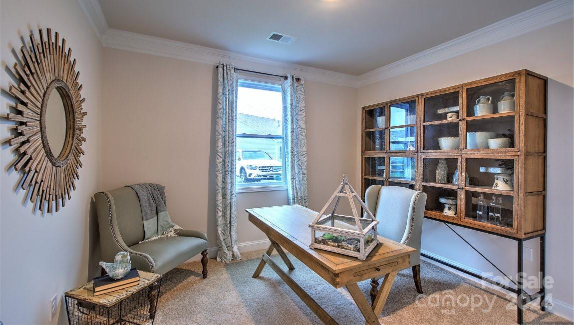 451 Fox Cove Road Hendersonville, NC 28792 - Photo 16 of 21 a work room with furniture and a book shelf