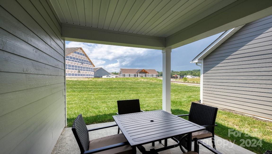 451 Fox Cove Road Hendersonville, NC 28792 - Photo 19 of 21 a view of a wooden deck with a table and chairs