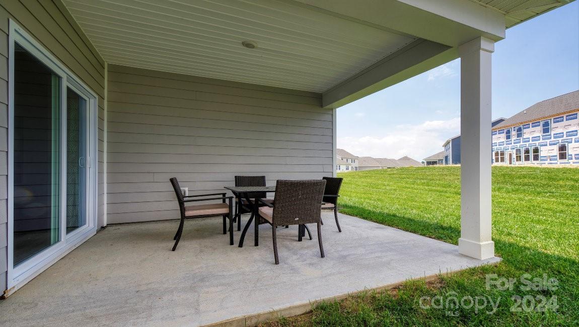 451 Fox Cove Road Hendersonville, NC 28792 - Photo 20 of 21 a view of a patio with a table chairs and backyard