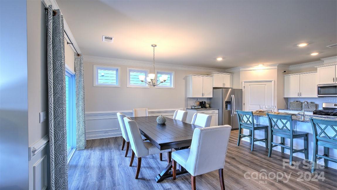 451 Fox Cove Road Hendersonville, NC 28792 - Photo 5 of 21 a view of a dining room with furniture and a dining table