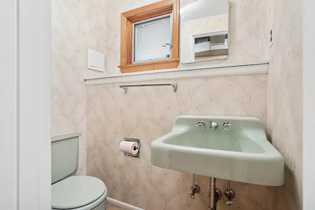 a bathroom with a sink and a toilet