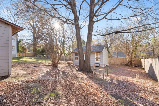 a view of a yard with a tree