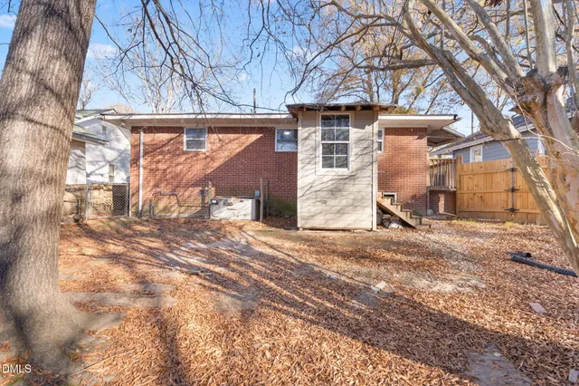 a view of a house with a snow in the yard