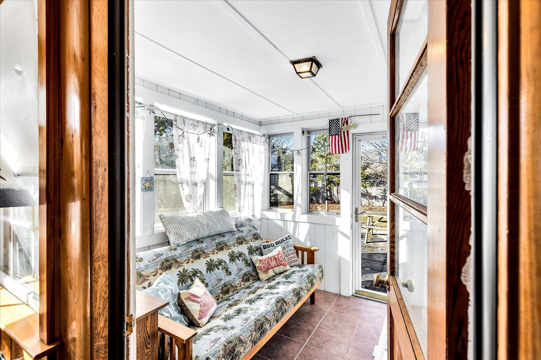 22 Edwards Road Dennis Port, MA 02639 - Photo 19 of 40 a living room with furniture and a large window