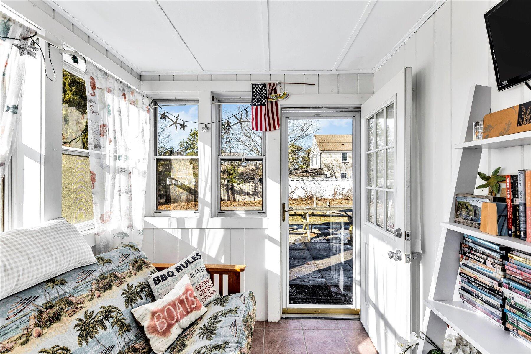 22 Edwards Road Dennis Port, MA 02639 - Photo 21 of 40 a living room with furniture and a flat screen tv