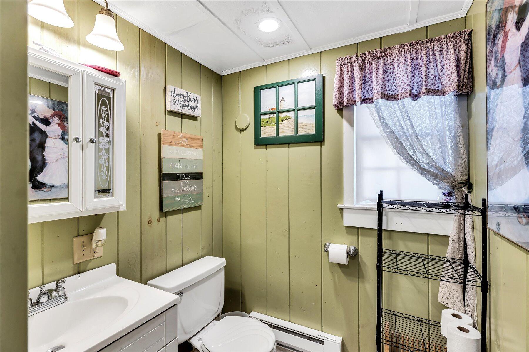 22 Edwards Road Dennis Port, MA 02639 - Photo 32 of 40 a bathroom with a sink toilet and shower