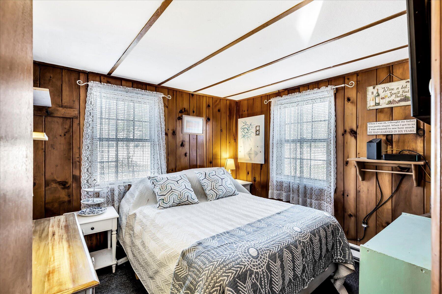 22 Edwards Road Dennis Port, MA 02639 - Photo 34 of 40 a bedroom with a bed closet and a window