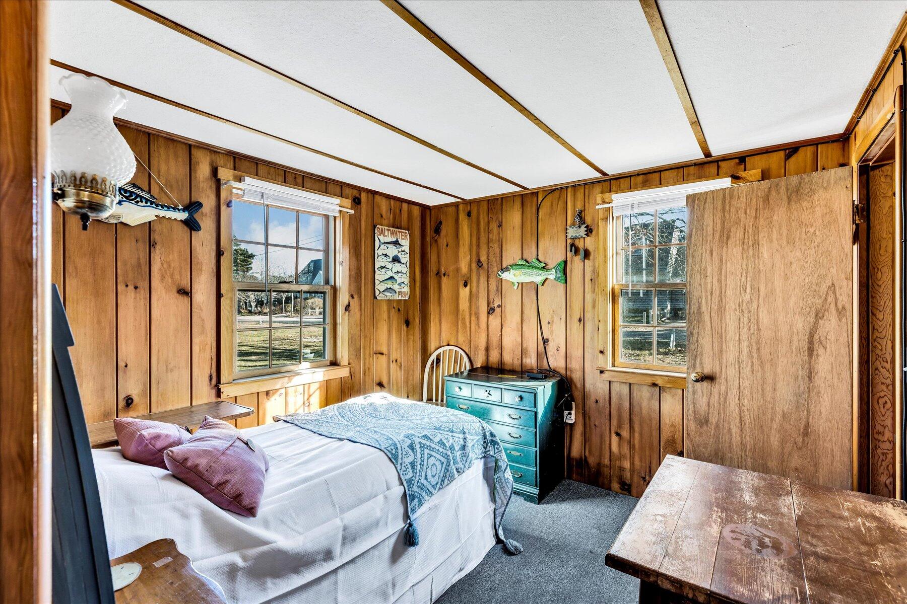 22 Edwards Road Dennis Port, MA 02639 - Photo 36 of 40 a bedroom with a bed and a window