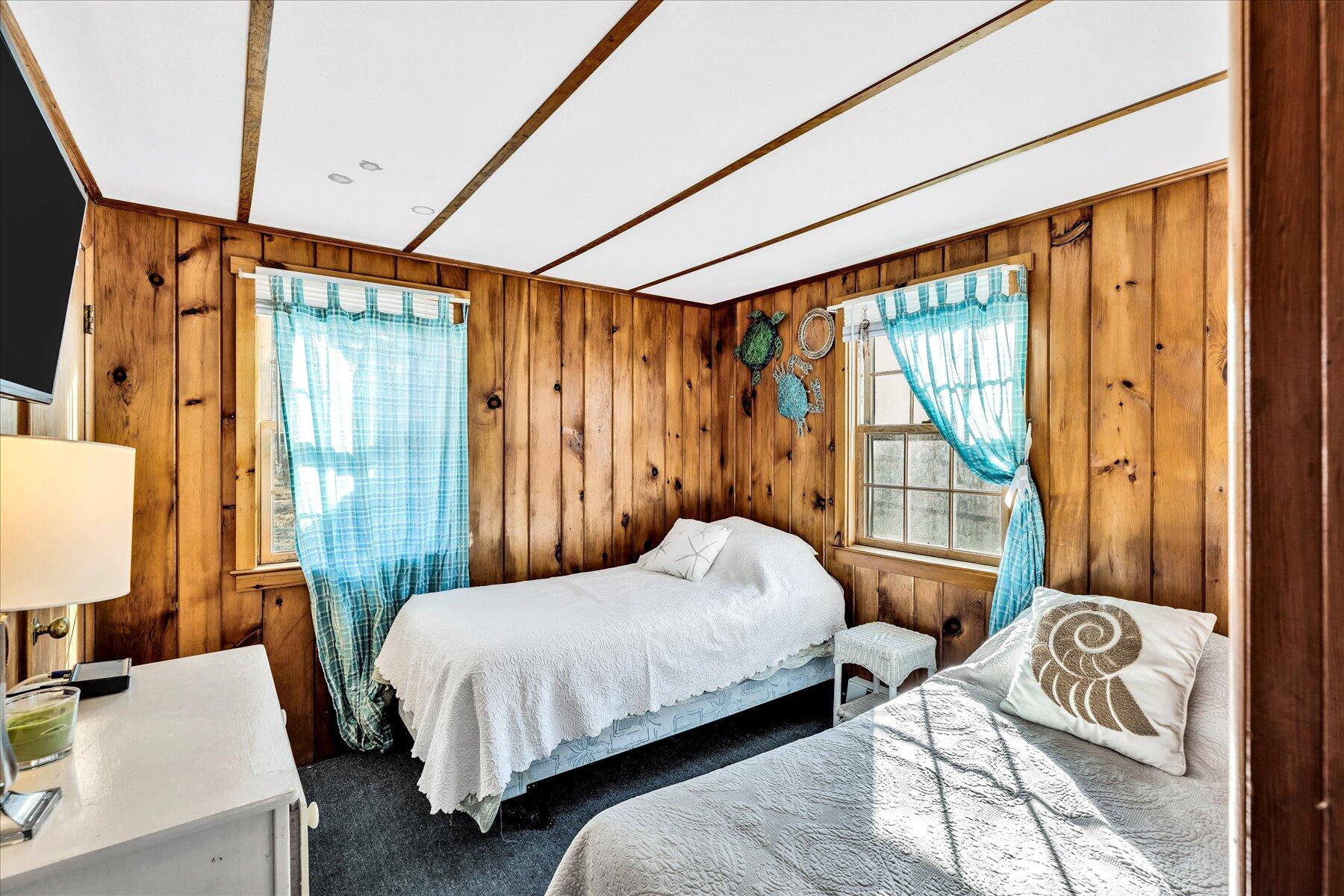 22 Edwards Road Dennis Port, MA 02639 - Photo 38 of 40 a bedroom with a bed and glass window