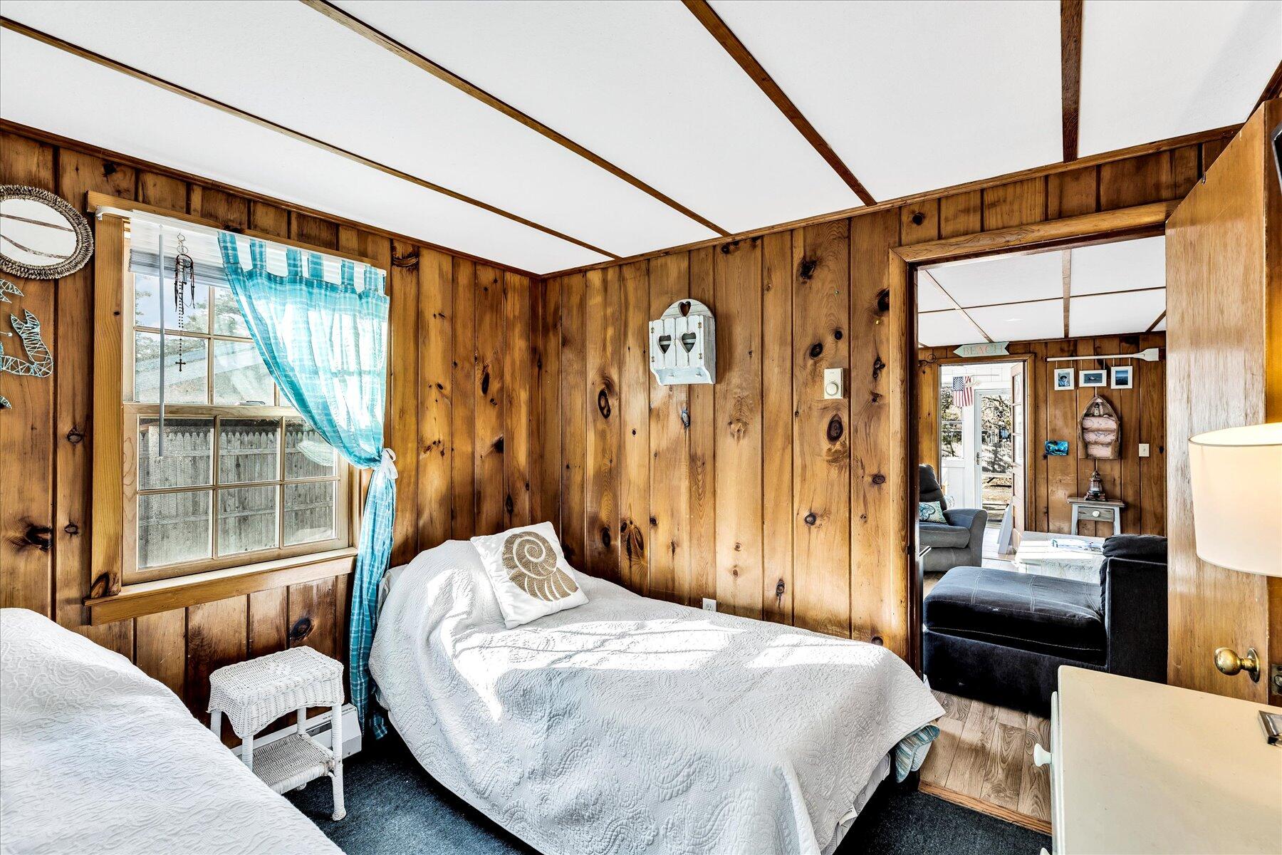 22 Edwards Road Dennis Port, MA 02639 - Photo 39 of 40 a bedroom with a bed and a couch