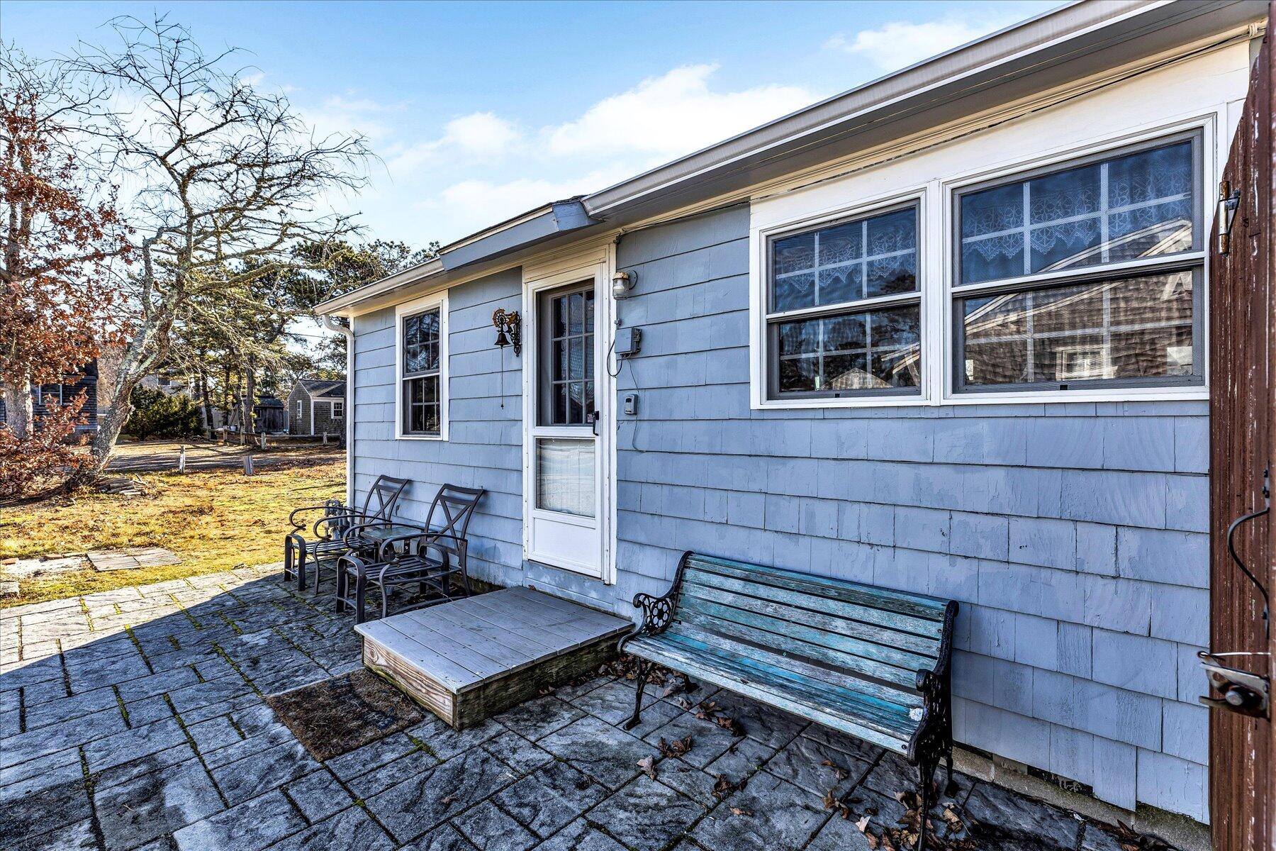 22 Edwards Road Dennis Port, MA 02639 - Photo 4 of 40 a view of a chairs and table on the deck