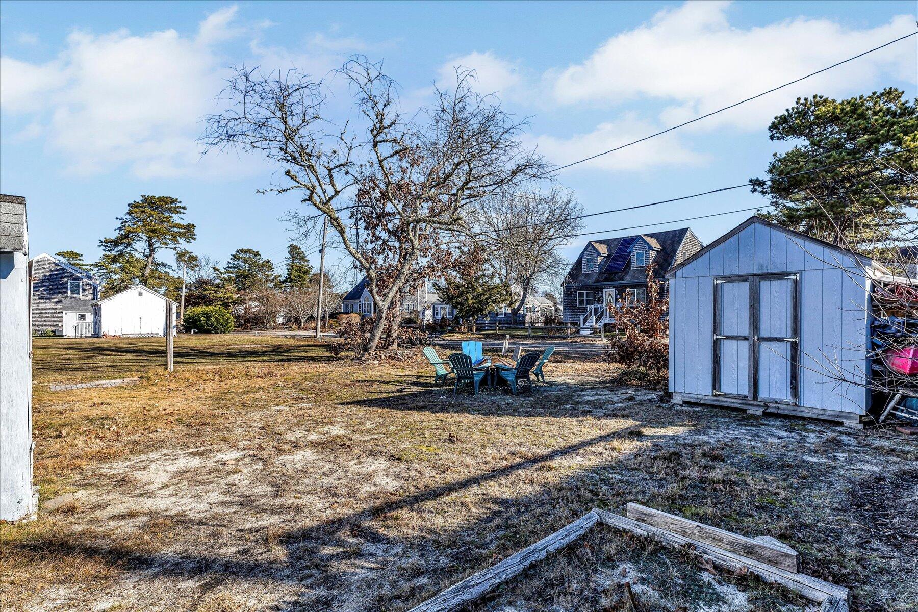 22 Edwards Road Dennis Port, MA 02639 - Photo 6 of 40 a view of a yard with wooden fence