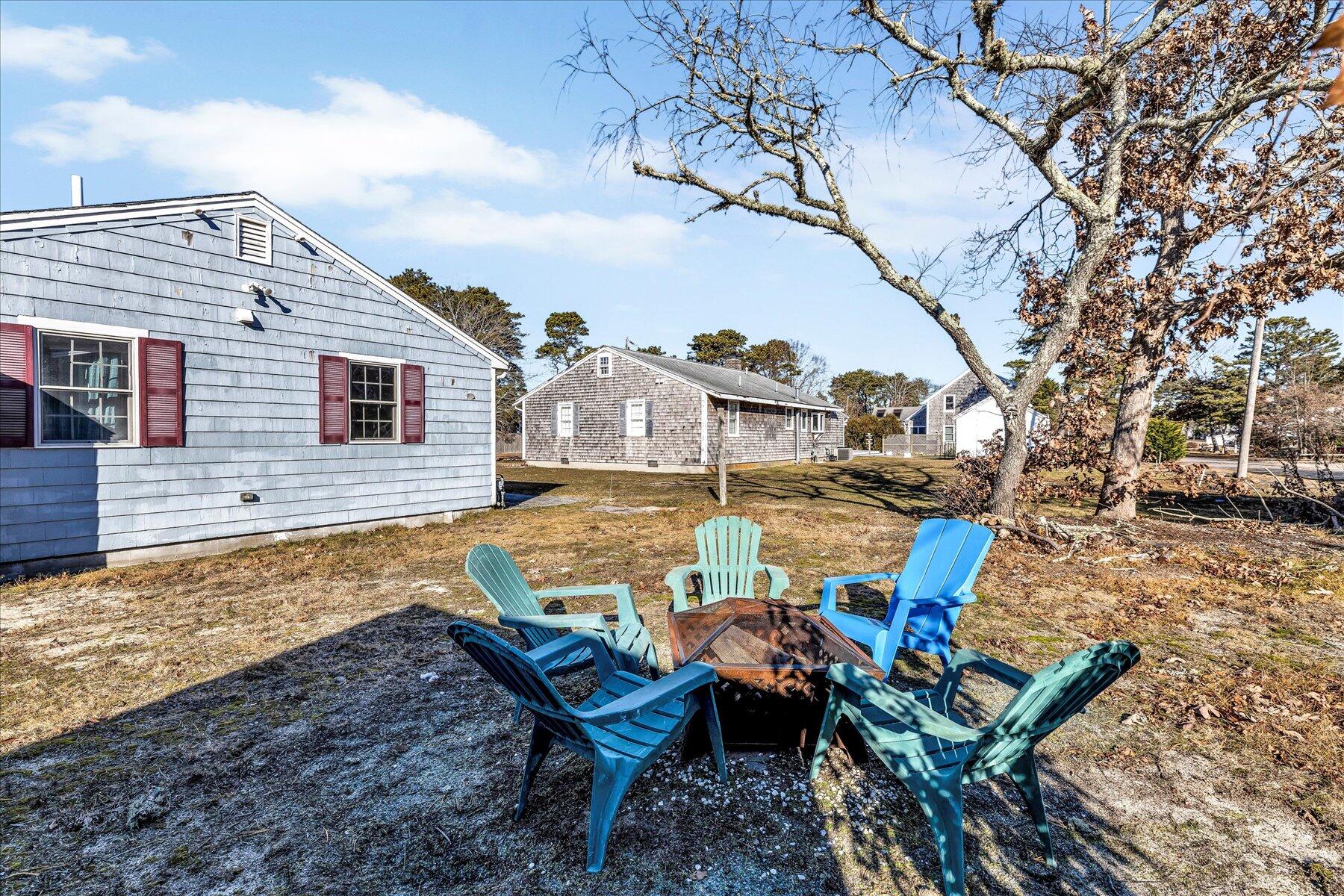 22 Edwards Road Dennis Port, MA 02639 - Photo 7 of 40 a view of a house with backyard and sitting area
