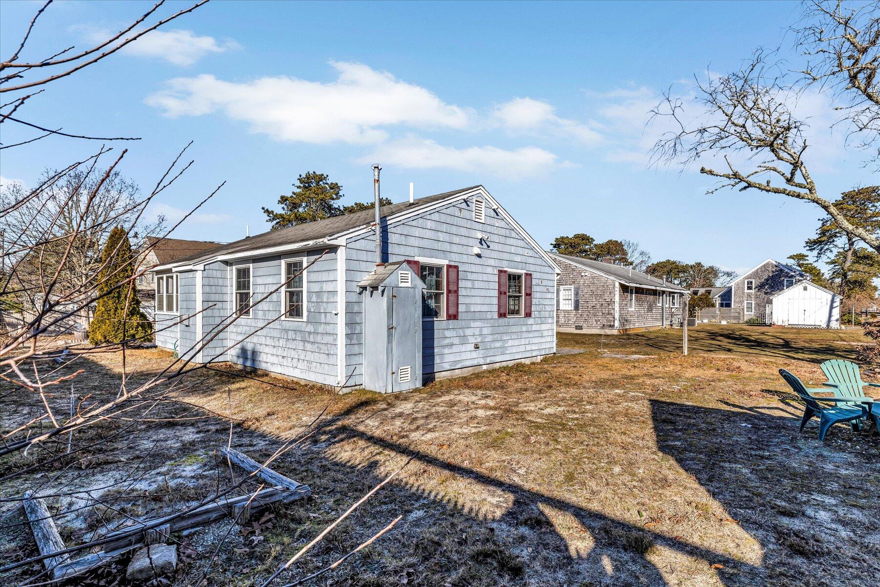 22 Edwards Road Dennis Port, MA 02639 - Photo 8 of 40 a view of a house with a yard