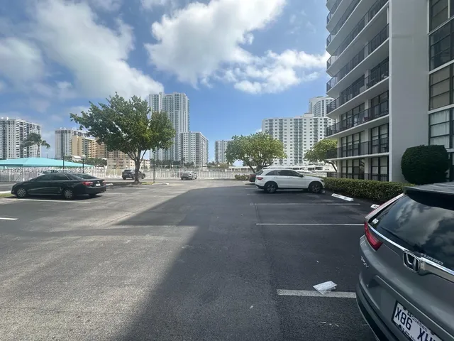a view of a street with a parking area
