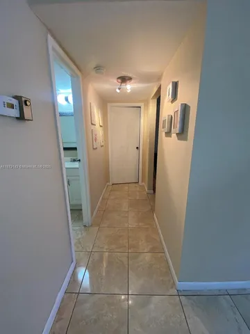 a kitchen with stainless steel appliances granite countertop a refrigerator a sink a stove and island