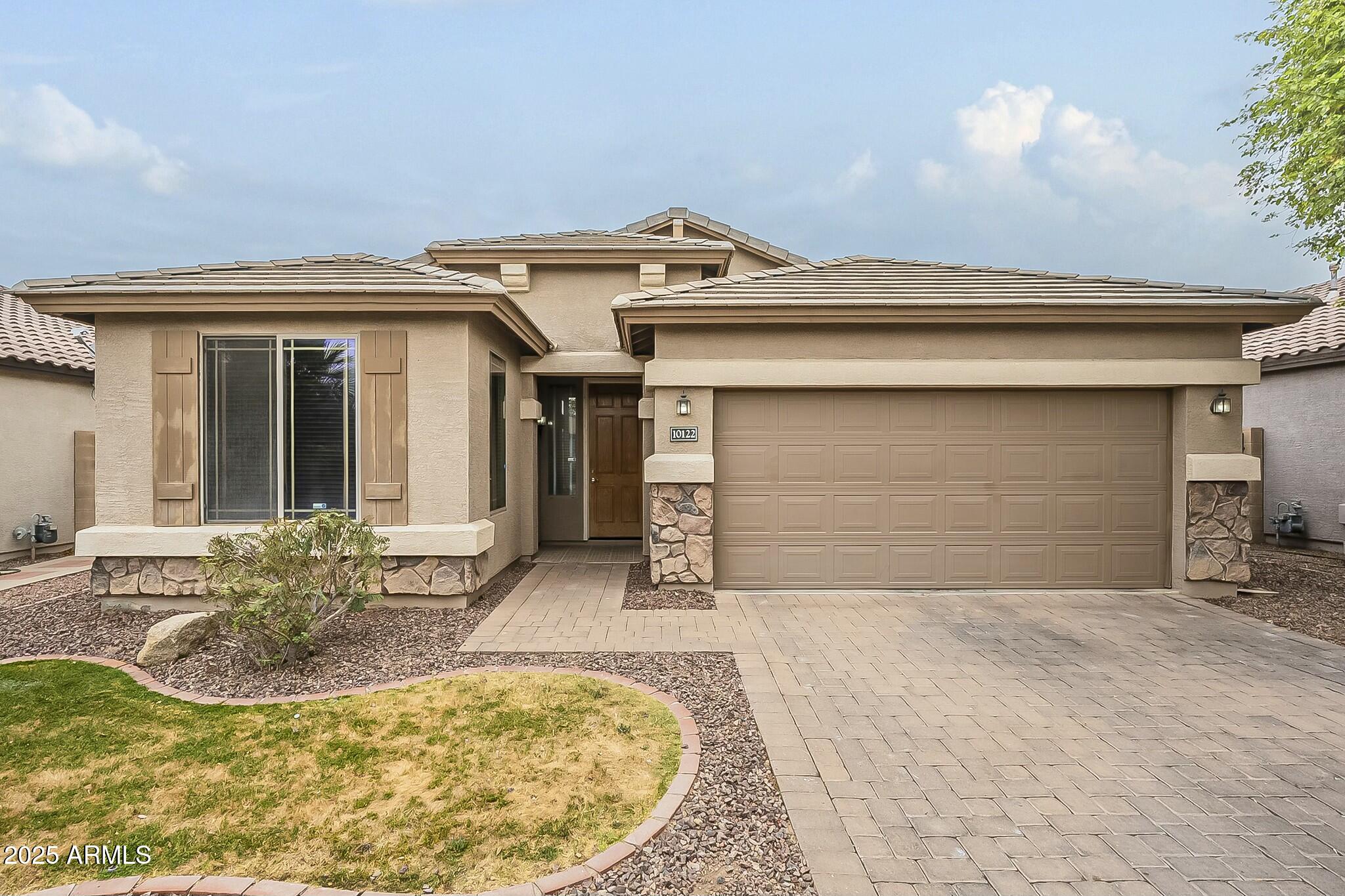 10122 West Payson Road Tolleson, AZ 85353 - Photo 3 of 56 a view of a house with a yard