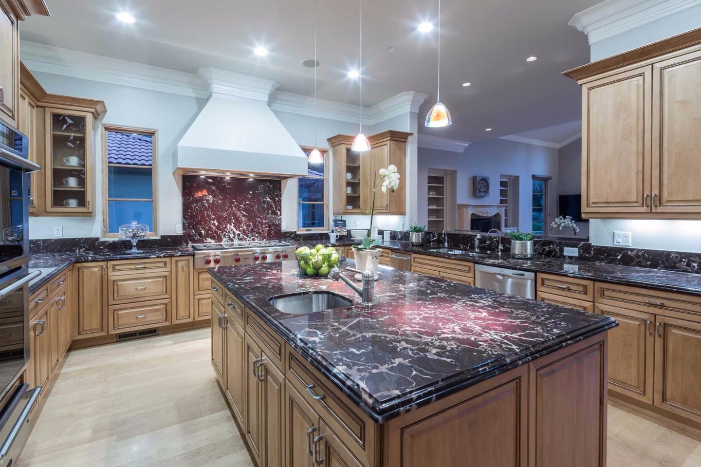 84 Nora Way Atherton, CA 94027 - Photo 11 of 37 a kitchen with stainless steel appliances granite countertop a stove a sink a oven and a refrigerator