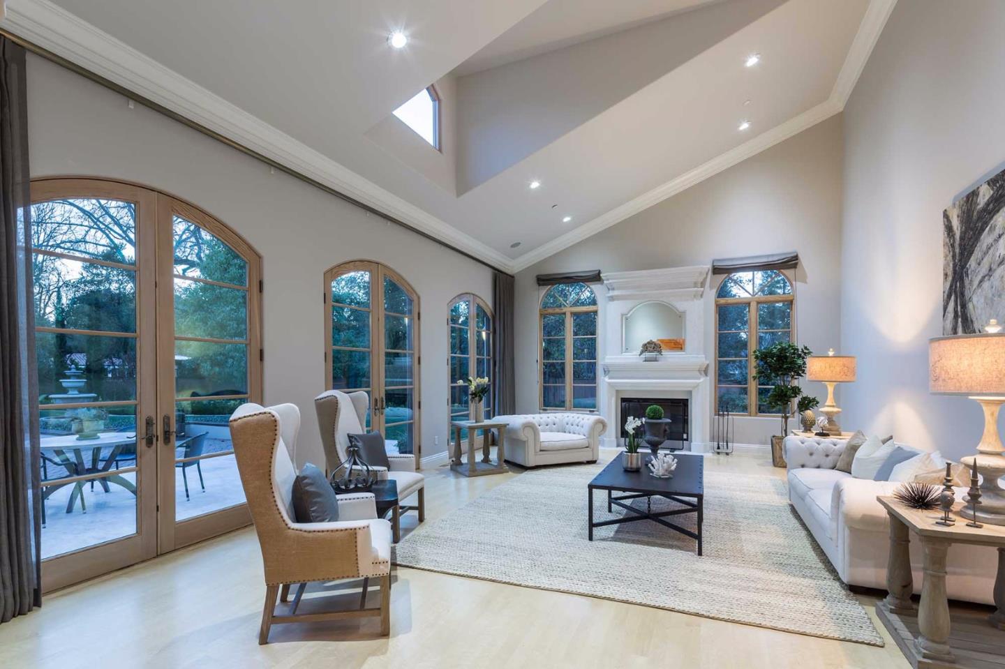 84 Nora Way Atherton, CA 94027 - Photo 17 of 37 a living room with furniture fireplace and large windows