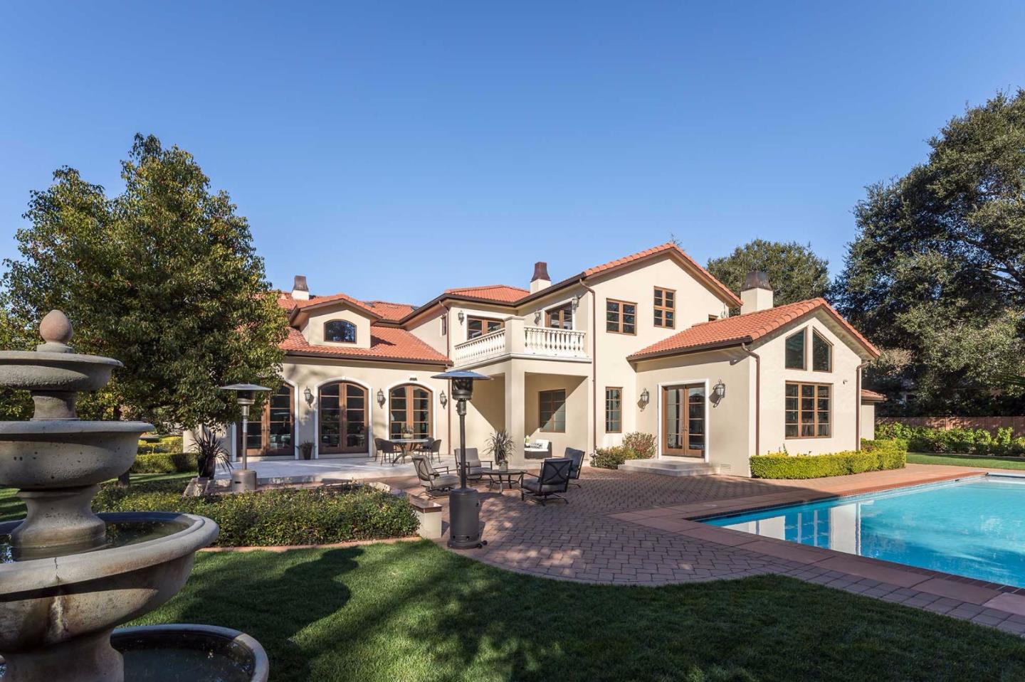 84 Nora Way Atherton, CA 94027 - Photo 32 of 37 a front view of a house with garden and patio