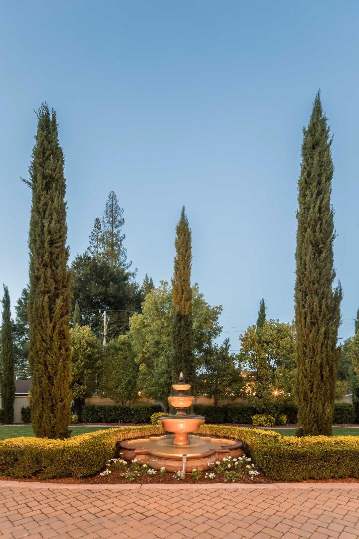 84 Nora Way Atherton, CA 94027 - Photo 33 of 37 a view of a fountain in front of a house