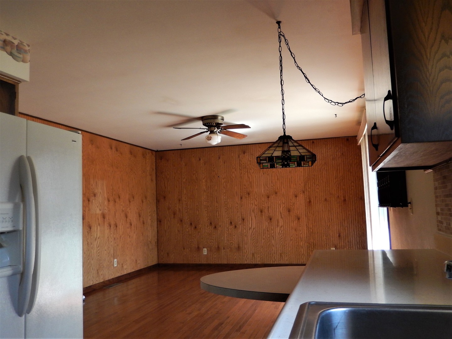 3249 River Road Kankakee, IL 60901 - Photo 7 of 18 a view of a living room with a refrigerator
