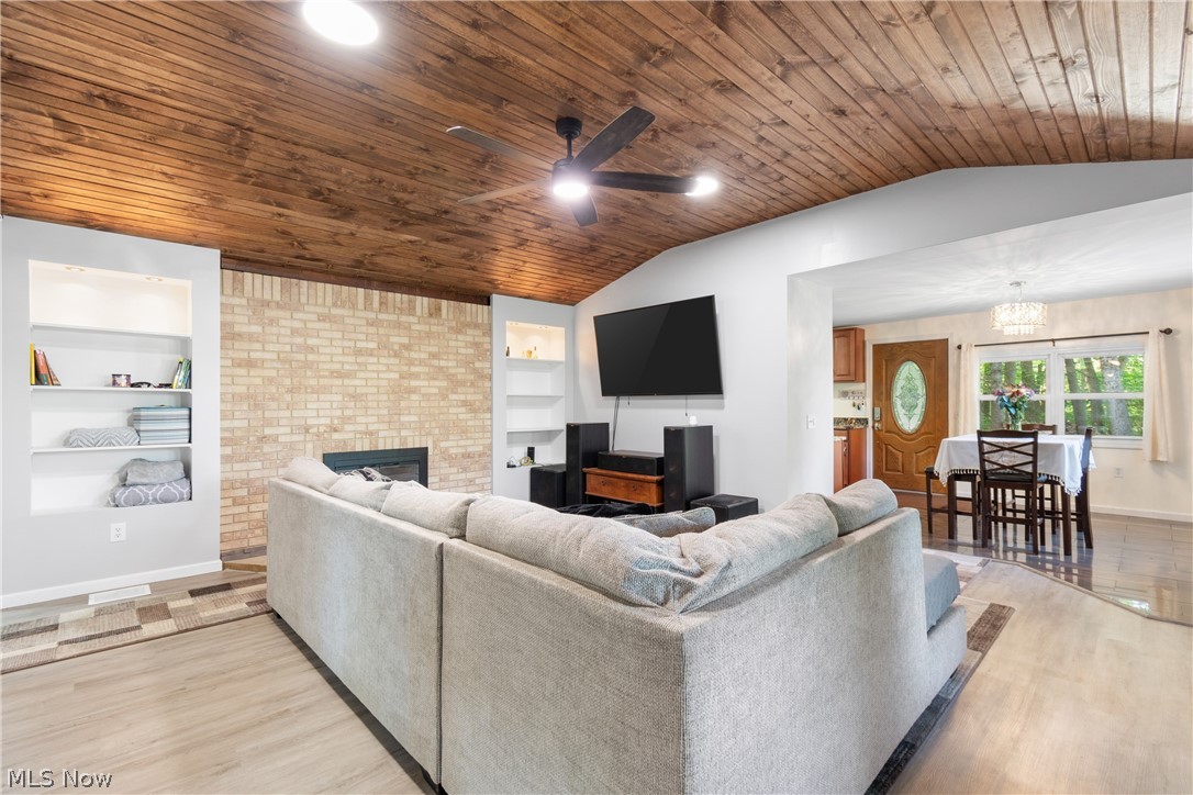 3255 Old Weymouth Road Medina, OH 44256 - Photo 6 of 31 Living room featuring wooden ceiling, a fireplace, light wood-type flooring, and ceiling fan