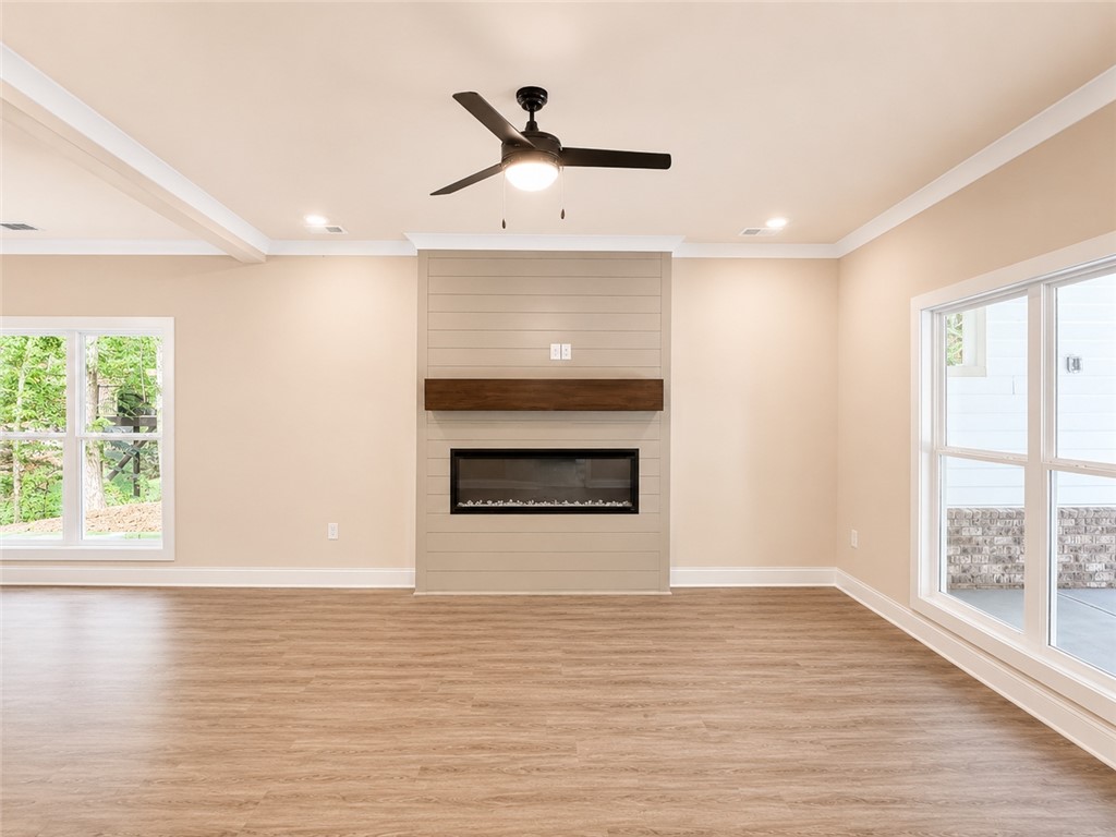 328 Point Road Westminster, SC 29693 - Photo 7 of 24 An inviting open-concept living space features a modern fireplace and abundant natural light.
