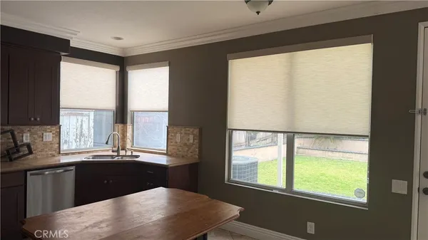 a kitchen with a large window and a sink